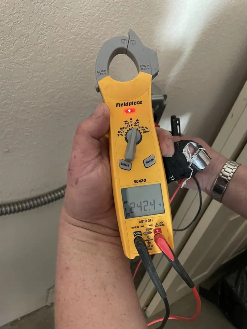 Voltage testing with clamp meter during Outlet Installation in Roanoke